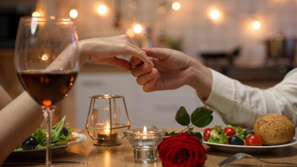 a photo of a couple enjoying a dinner out for Valentine's Day.
