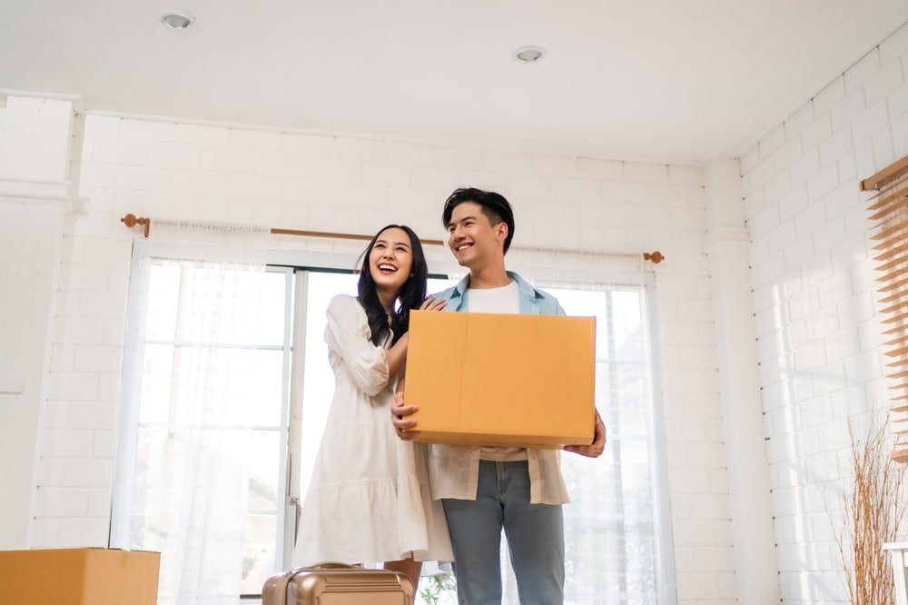a photo of a young couple who are now new homeowners.
